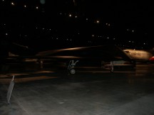 dark photograph of an airplane indoors